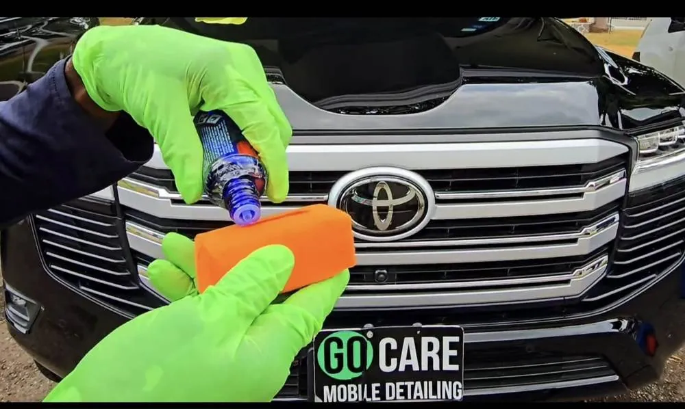 Applying ceramic coating to a black Toyota